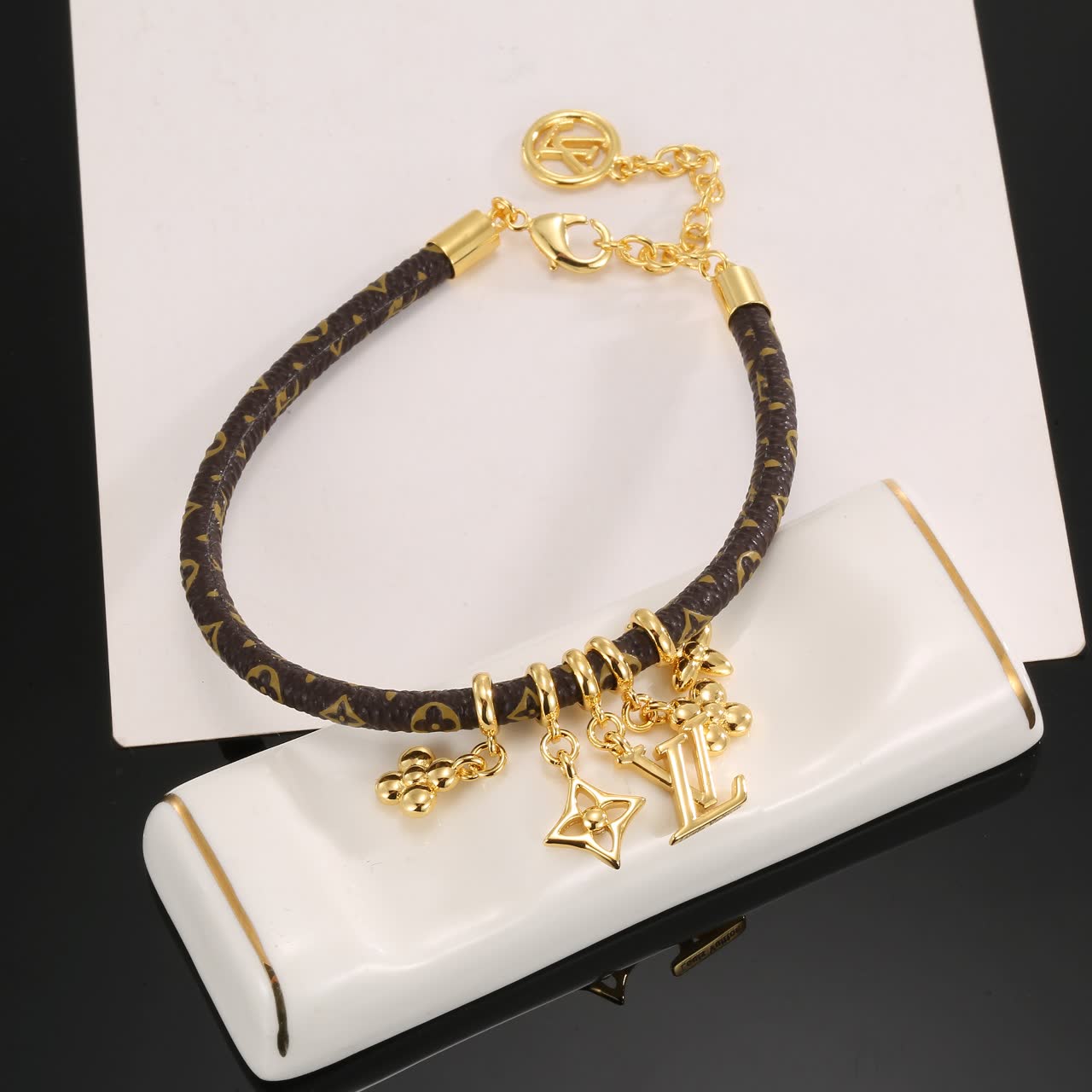Louis Vuitton Monogram Leather Bracelet with Gold Charms